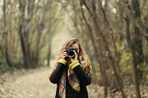 Woman taking photos at forest containing autumn, photos, and photographer