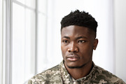 Pensive african american soldier in military uniform sitting on couch, a Photo by Prostock-Studio (Thumbnail 2 of 5)