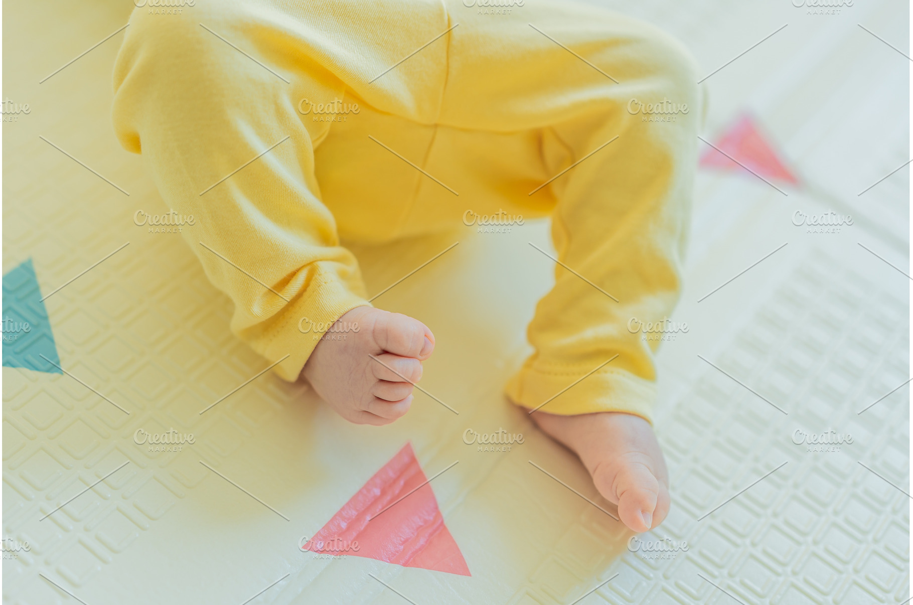 Adorable baby in a yellow hat lying, a Person Photo by Elizaveta Galitskaya