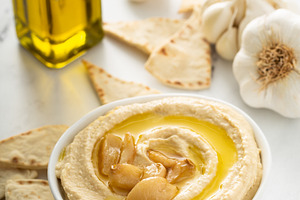 Roasted garlic hummus topped with olive oil