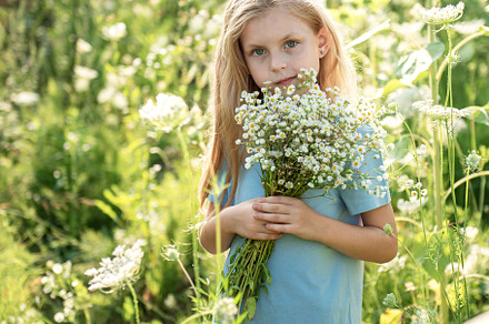 Beautiful little girl in sunflowers, a Person Photo by Olena Rudo