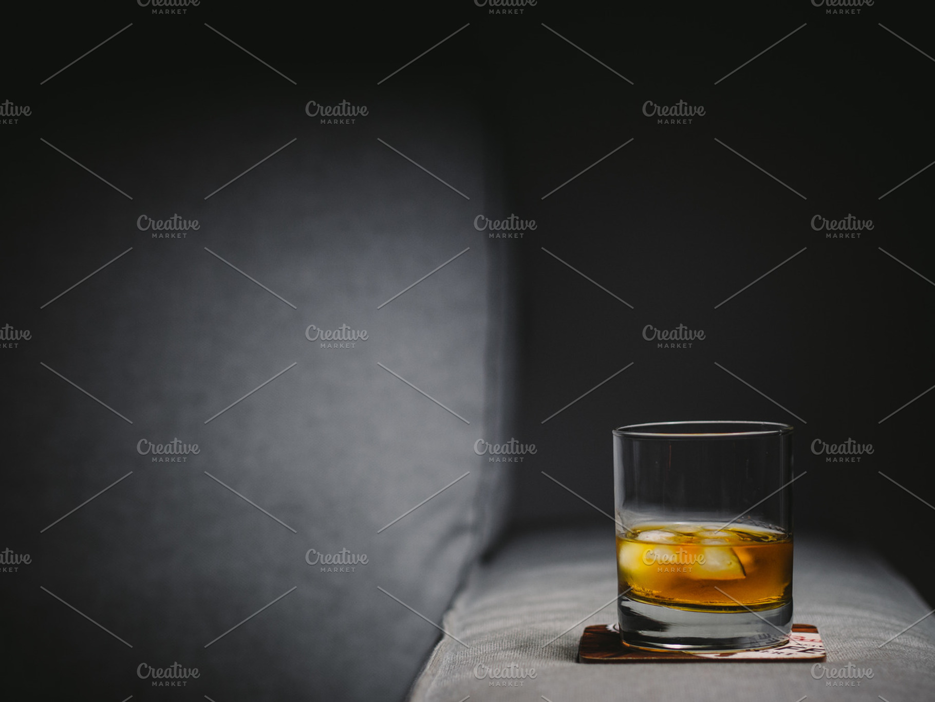Glass of whisky with ice, a Food & Drink Photo by Pawel Kadysz