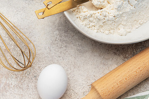 Baking ingredients preparing dough on kitchen counter, a Food & Drink Photo by Olena Rudo
