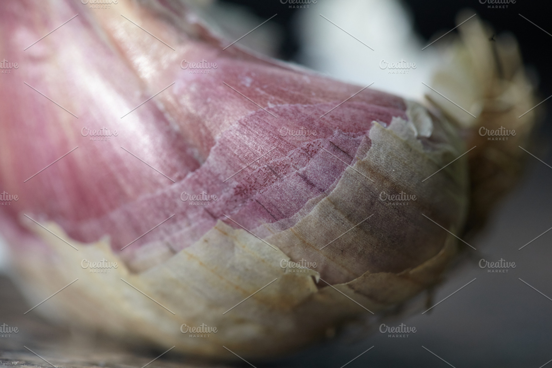 Macro of organic purple garlic bulb with papery skin texture., a Nature Photo by Rohan Photography