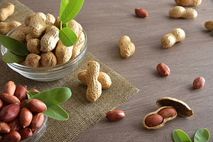 Peanut in glass bowls on wooden kitchen bench elevated view, a Food & Drink Photo by Davizro's Market