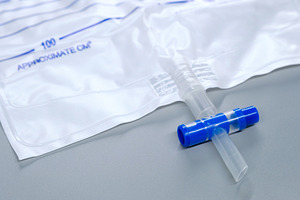 Close-up of a medical urine drainage bag T-valve cross drain. Detailed view of, a Health & Medical Photo by Rohan Photography