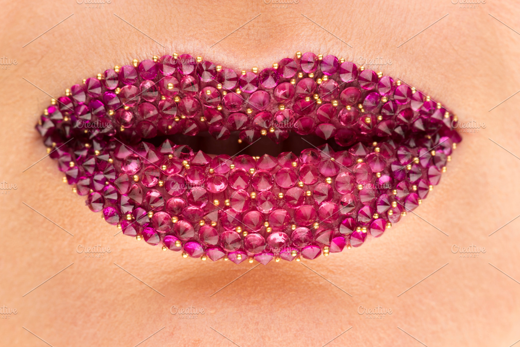 Female lips adorned with precious st, a Beauty & Fashion Photo by oleghz