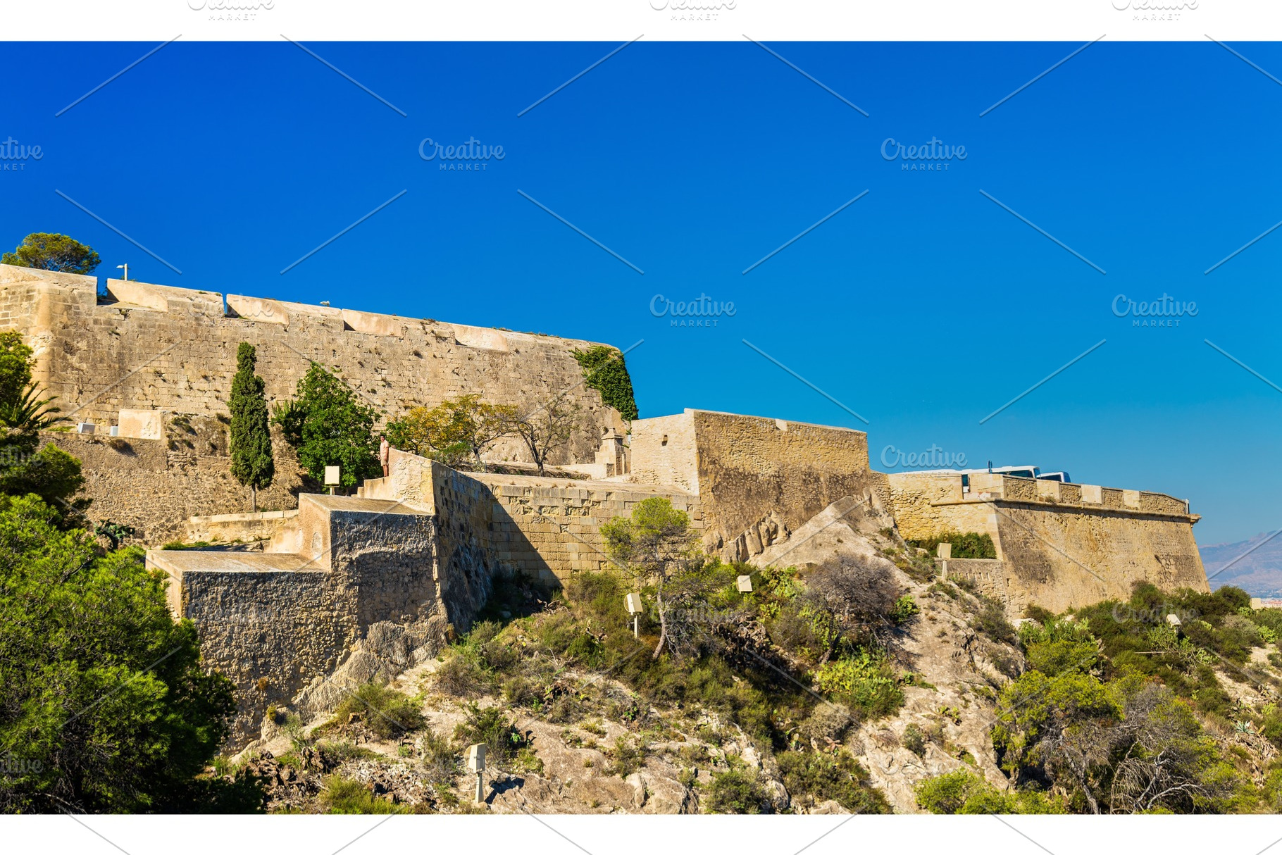 Walls of santa barbara castle in alicante spain featuring spain, alicante, an Architecture Photo by Leonid Andronov