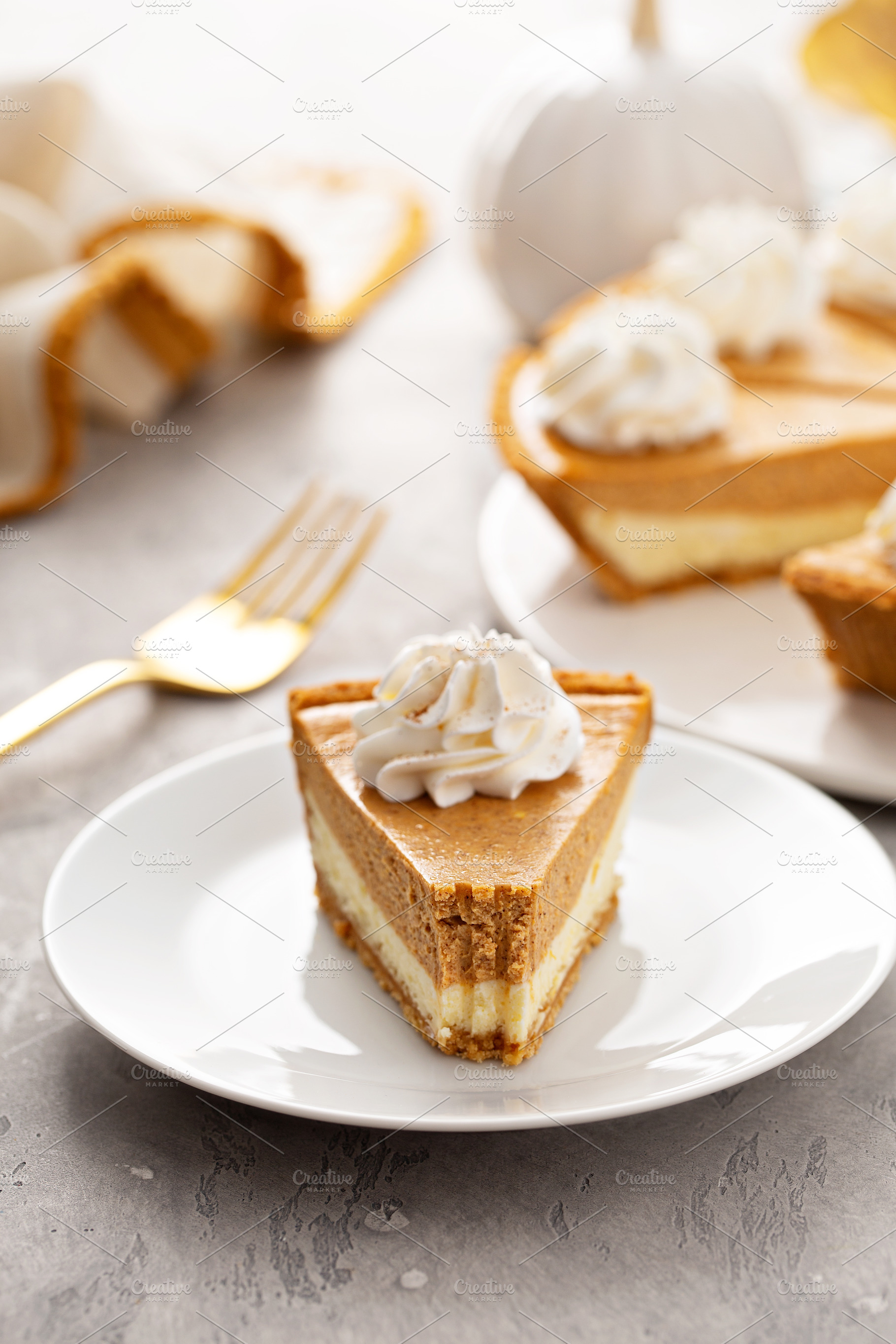 Slice of pumpkin pie with a cheesecake layer, a Food & Drink Photo by farwasser