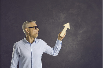 Senior man standing on gray, a Business Photo by StudioRomantic