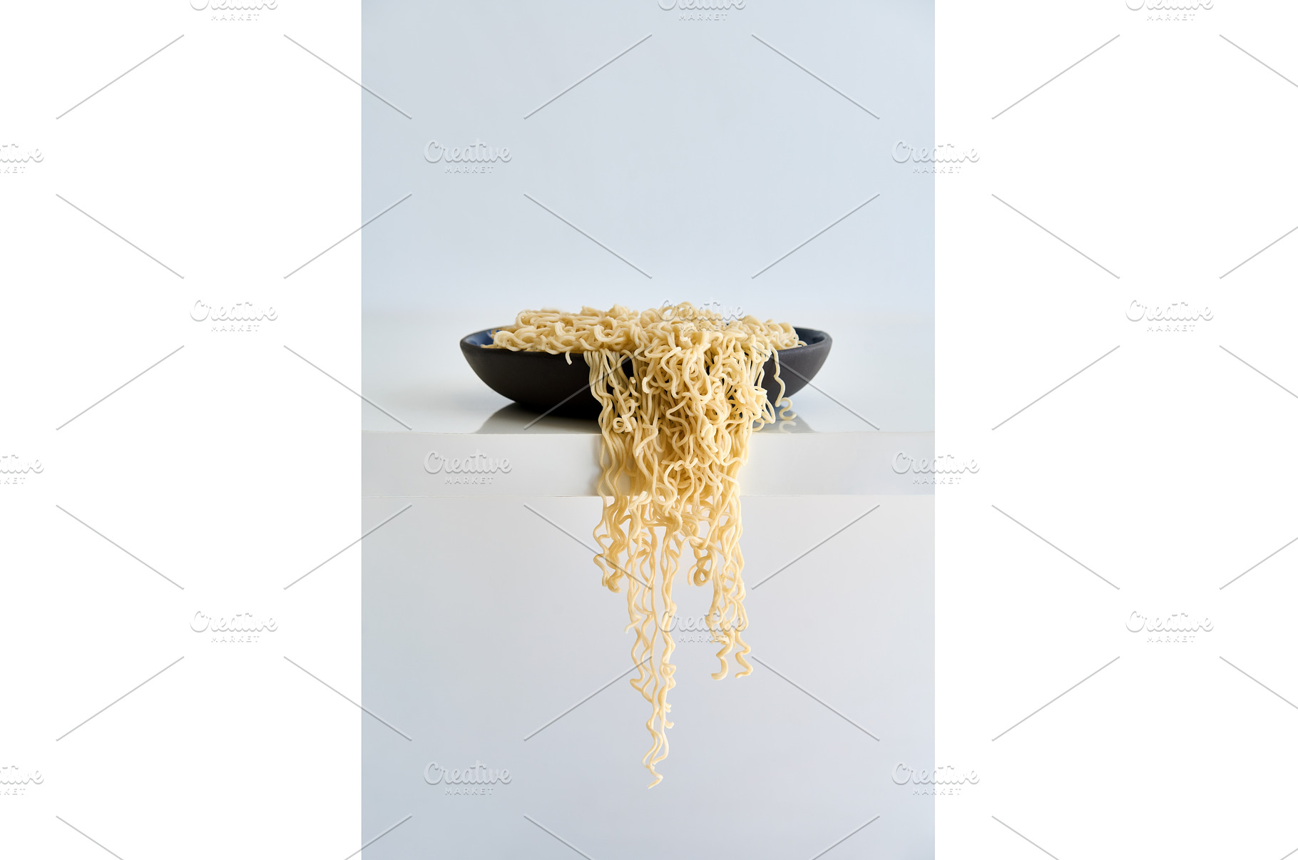 Cooked instant noodles overflow and, a Food & Drink Photo by Gladkov photography