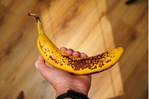 Brightly colored banana with brown, a Background Photo by darksoul72