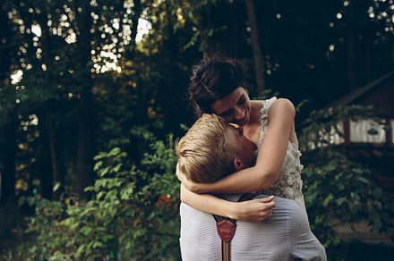 Groom holds bride in his arms containing couple, wedding, and bride, a Person Photo by Tekso