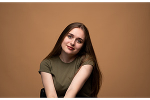 Young woman smiling gently, head, a Person Photo by volodymyrshtun13795