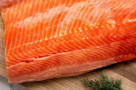 Organic Raw Salmon Fillet on a wooden board, top view. Flat lay,, a Food & Drink Photo by LiudmylaChuhunova