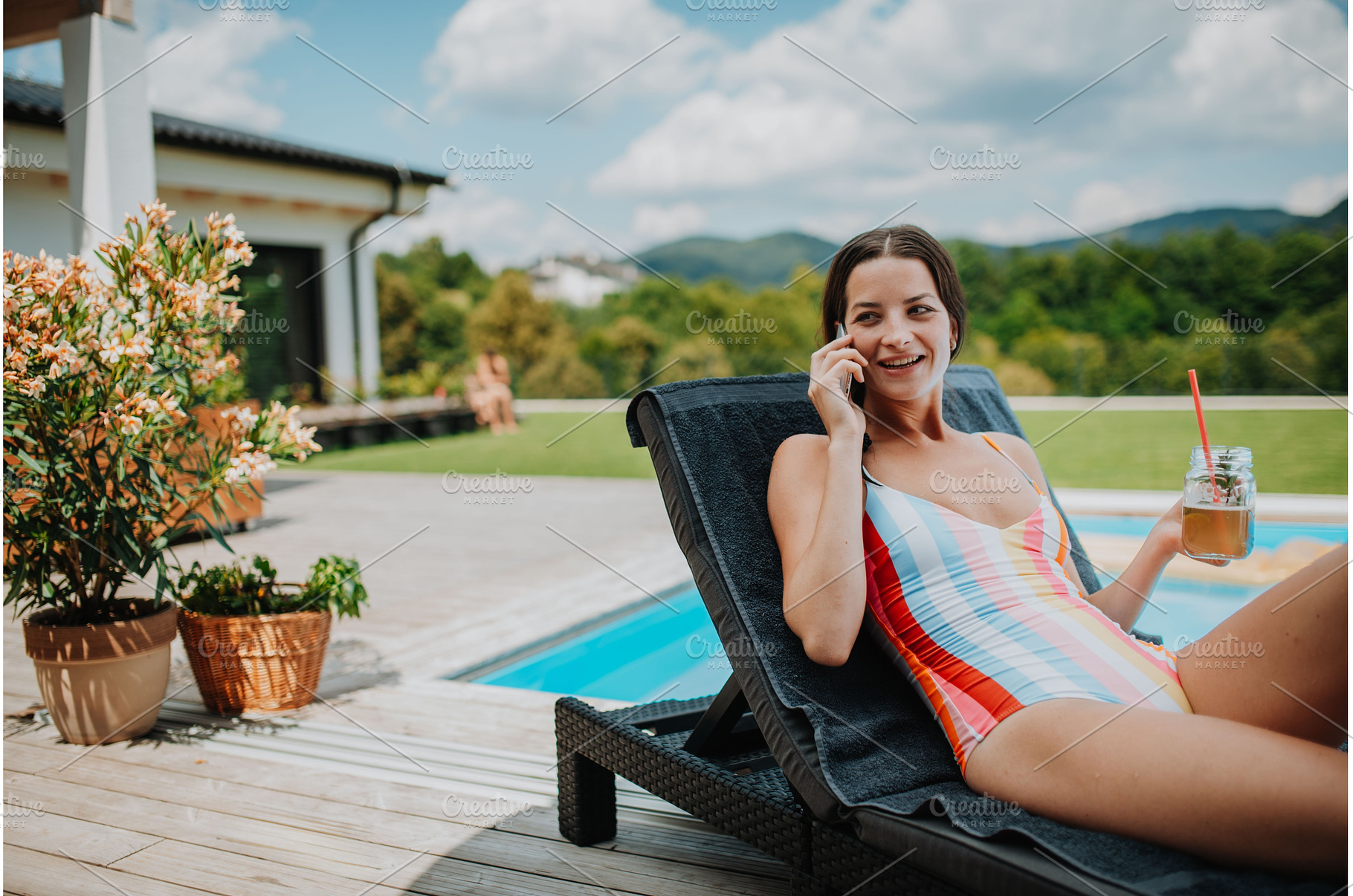 Young woman in swimsuit sitting by, a Person Photo by HalfPoint