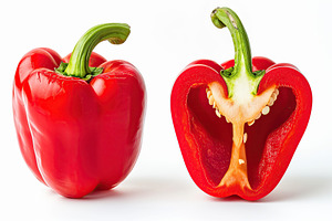 Ripe red whole pepper and half of pepper isolated on white background, a Food & Drink Photo by AlyaAnd