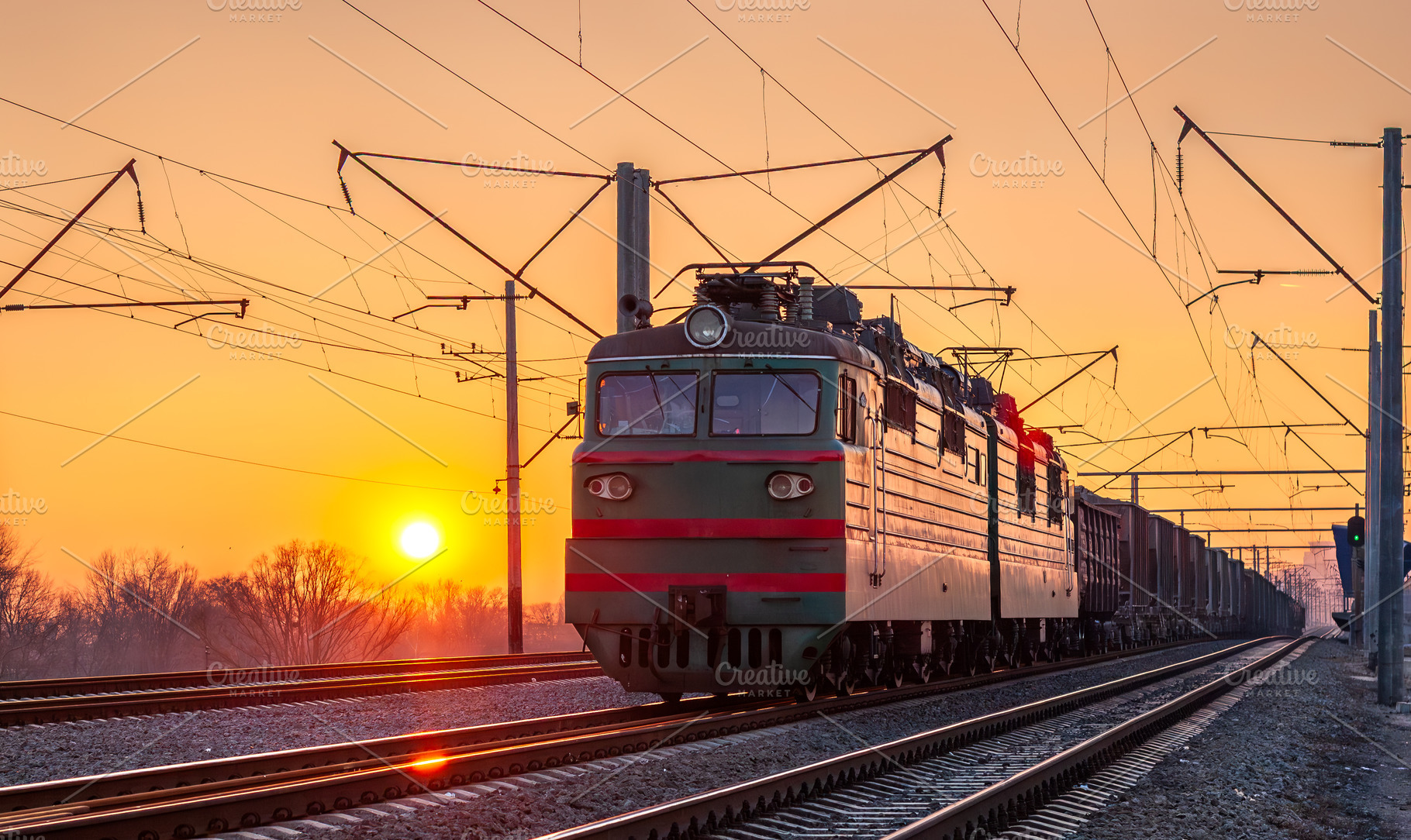 Freight electric locomotive at sunset in Kyiv, Ukraine, a Transportation Photo by Leonid Andronov