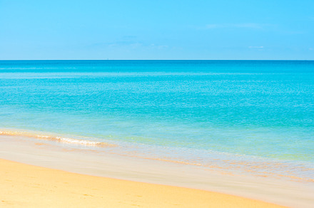 Blue sea water and sand beach, a Nature Photo by Vapi