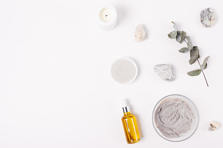 Cosmetic clay facial mask next to organic oil, a Beauty & Fashion Photo by progressman