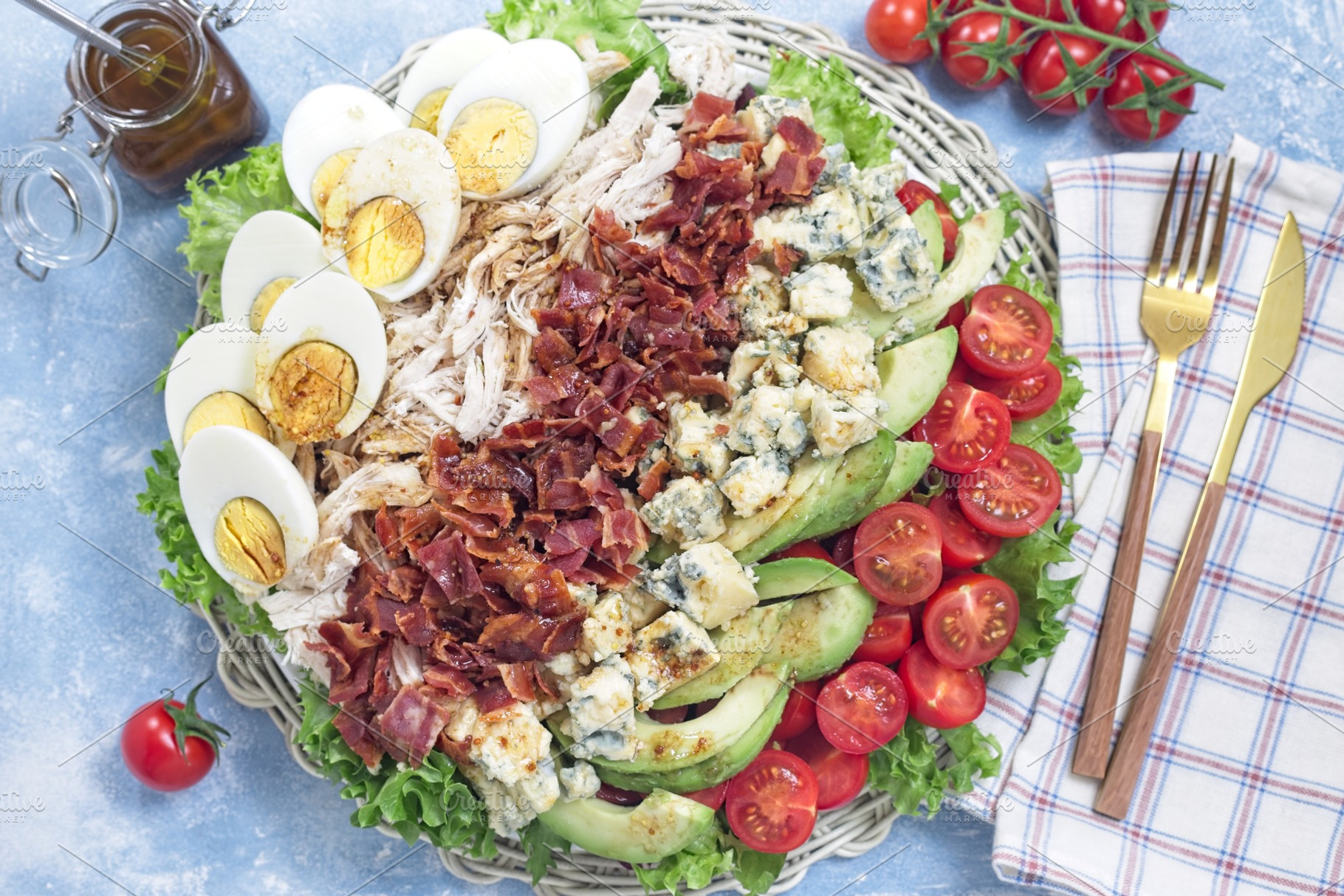 Cobb salad with greens, tomato, avocado, blue cheese, bacon, chicken and eggs,, a Food & Drink Photo by iuliia_n