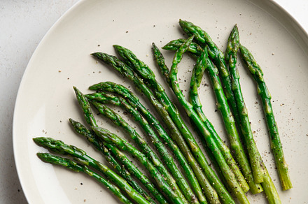 Grilled green asparagus on a a plate, top view., a Food & Drink Photo by FoodStock
