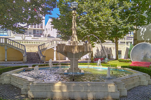 Stone fountain surrounded by trimmed hedges, an Architecture Photo by DanFLCreativo
