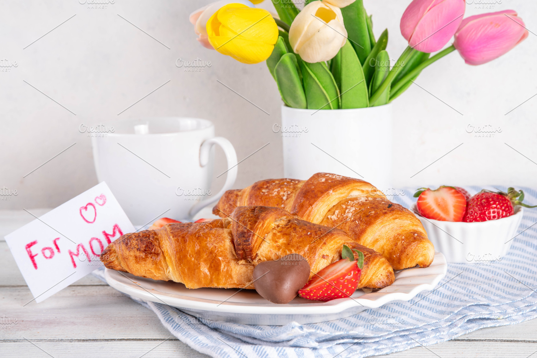 Mother’s Day breakfast background featuring croissant, strawberr, a Holiday Photo by Rimma