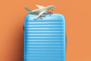 Suitcase and airplane model, minimal