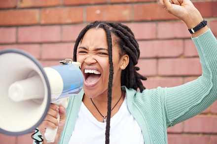 Speaker, protest or angry black woman with speech announcement for politics, equality or human rights. Young feminist leader, stop or loud gen z girl shouting for justice or help on wall background, a Photo by Peopleimages.com