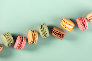 Colorful Macarons in Diagonal Line on Pastel Background, a Holiday Photo by Natalia Klenova's Shop