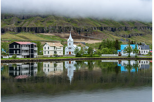 Famous Blue church surrounded by low, an Architecture Photo by Backyard Stock