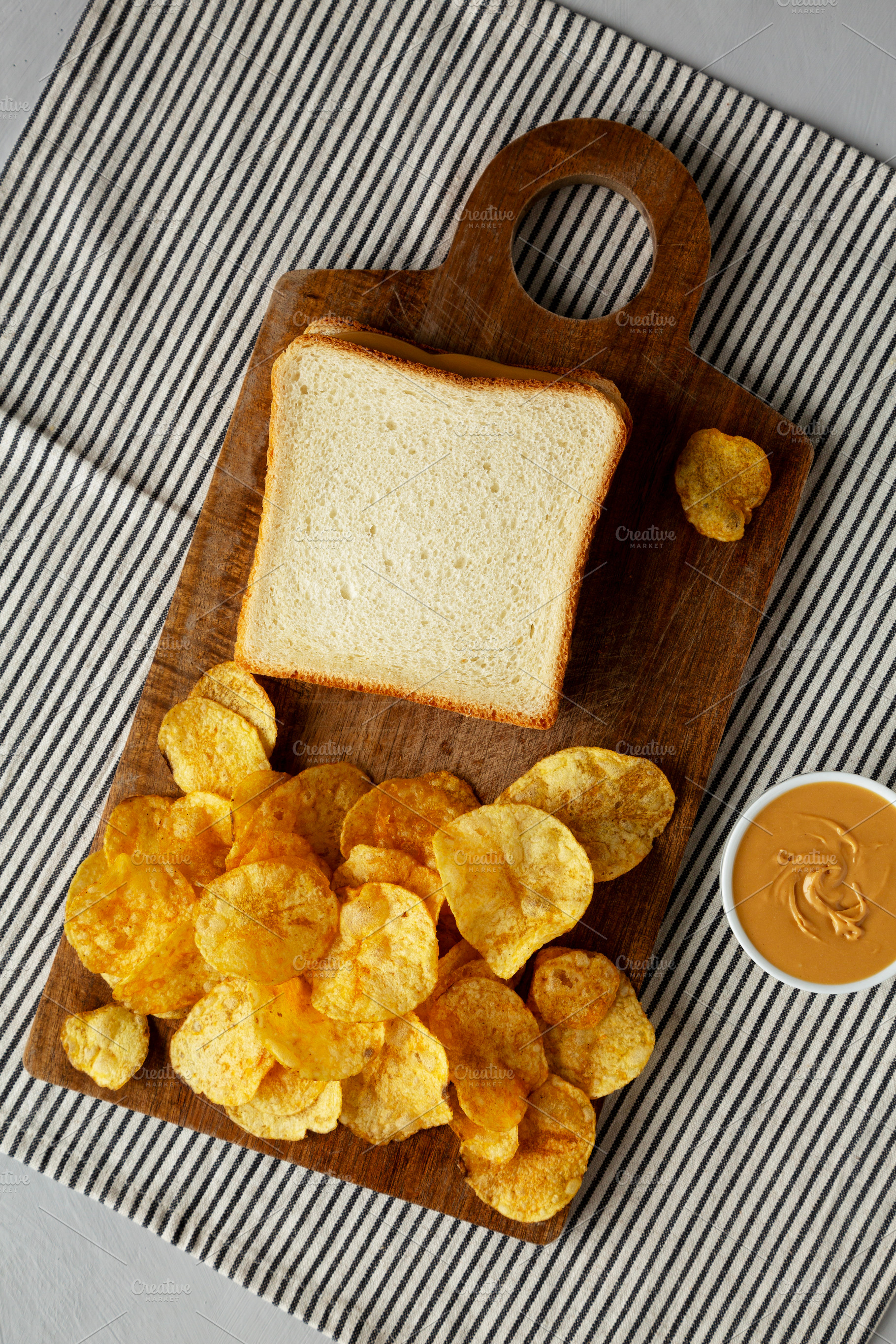 Homemade American Peanut Butter Sandwich on a Wooden Board, top, a Food & Drink Photo by LiudmylaChuhunova