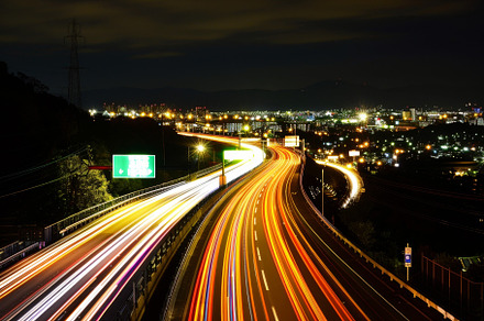The highway is illuminated by streak, a Photo by Tanuart