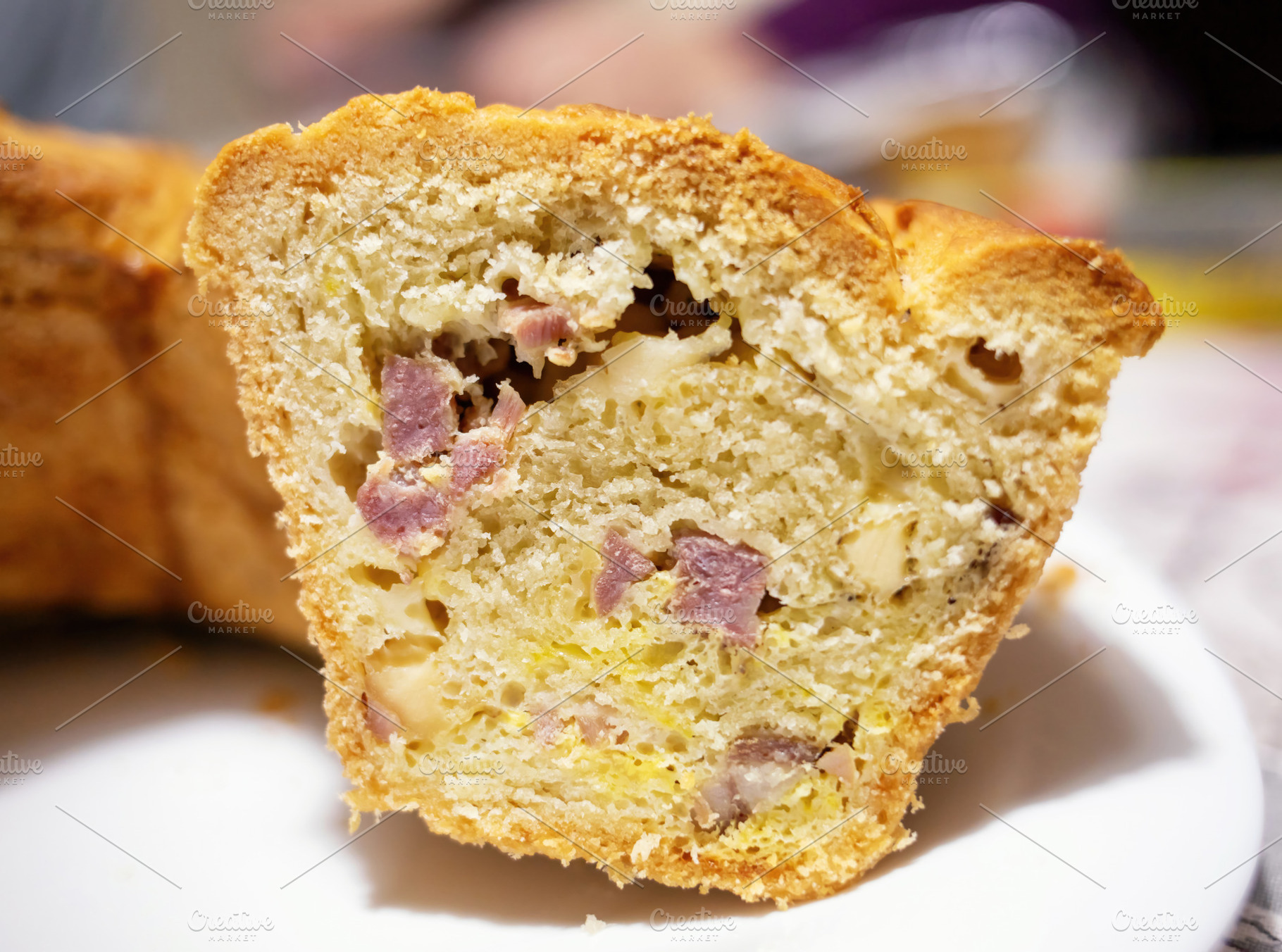Slice of neapolitan tortano showcasing cheese and salami filling, a Food & Drink Photo by Antonio Gravante Market