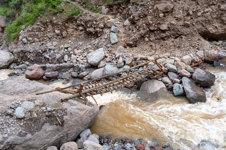 Old bridge crossing the river in Colca Canyon, Peru, a Nature Photo by GoodGoods