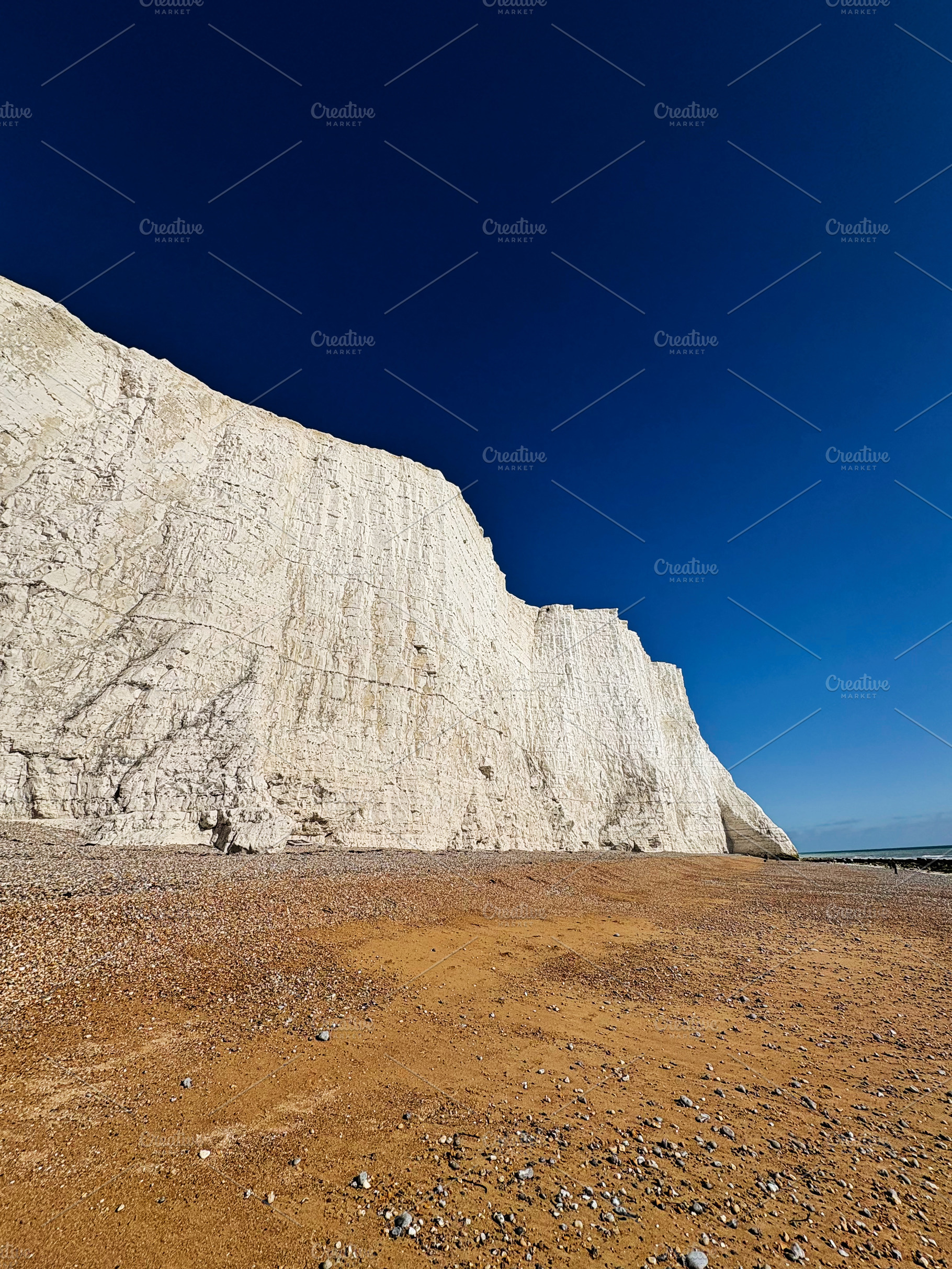 White chalk cliffs at Seven Sisters in East Sussex on a clear blue sky day, a Nature Photo by AS photostudio