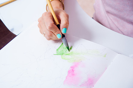 Artist draws a watercolor paint, a Person Photo by Sova