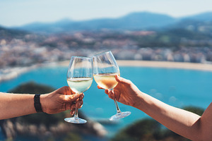 Two groceries with white wine featuring wine, drink, and glass