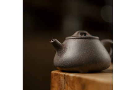 An Elegant Dark Teapot Placed on a, a Background Photo by Media Whale Stock