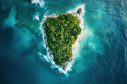 Bird eye view of a lush green island, a Photo by Iftikhar Alam