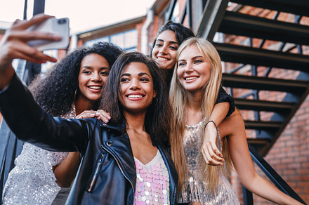 Group of stylish women taking selfie, a Holiday Photo by Artem Varnitsin