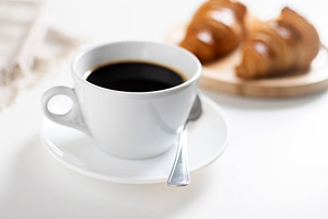 Black Coffee Cup with Croissants, a Food & Drink Photo by etorres69