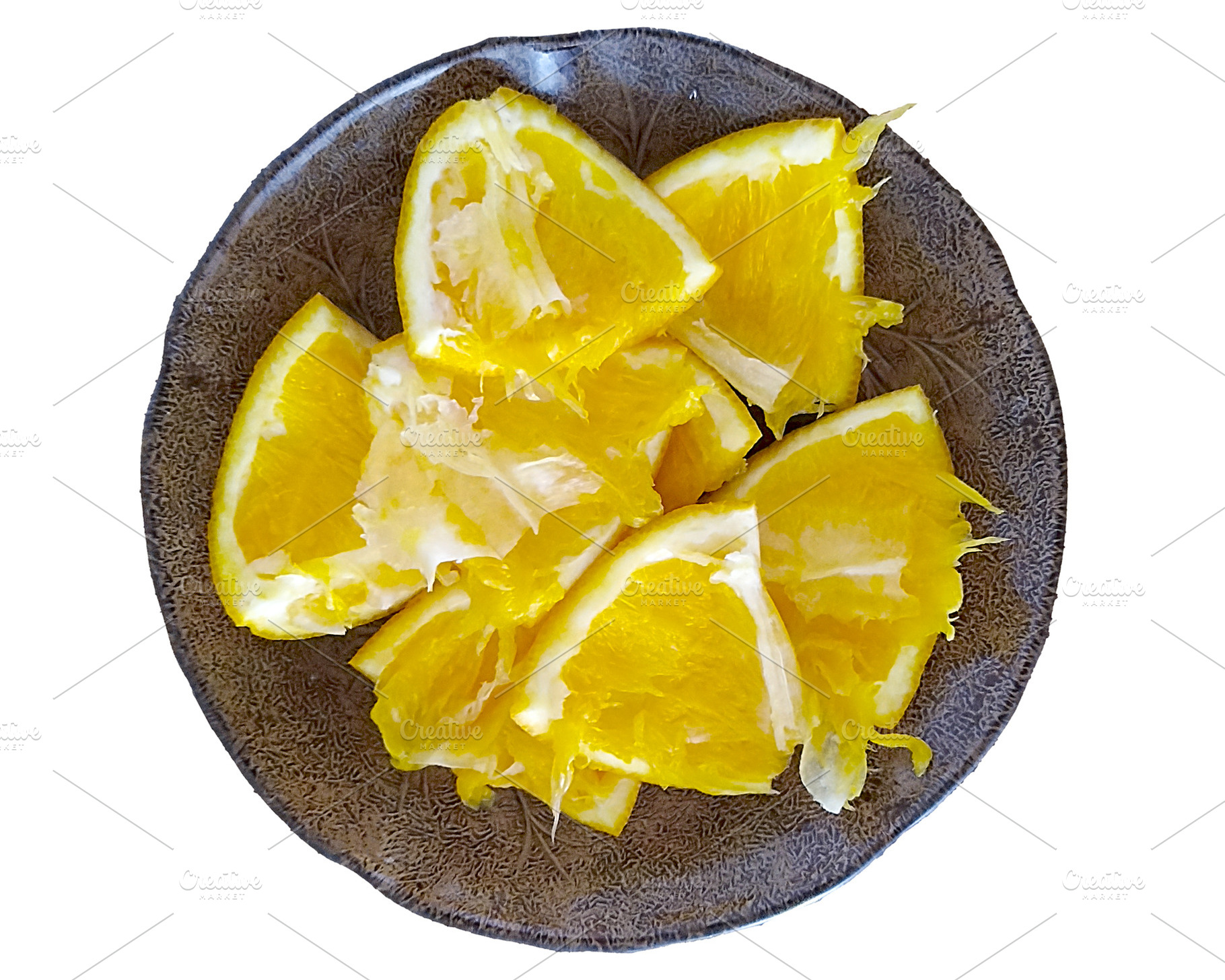 Plate with freshly cut orange slices placed on a bowl, a Food & Drink Photo by DanFLCreativo
