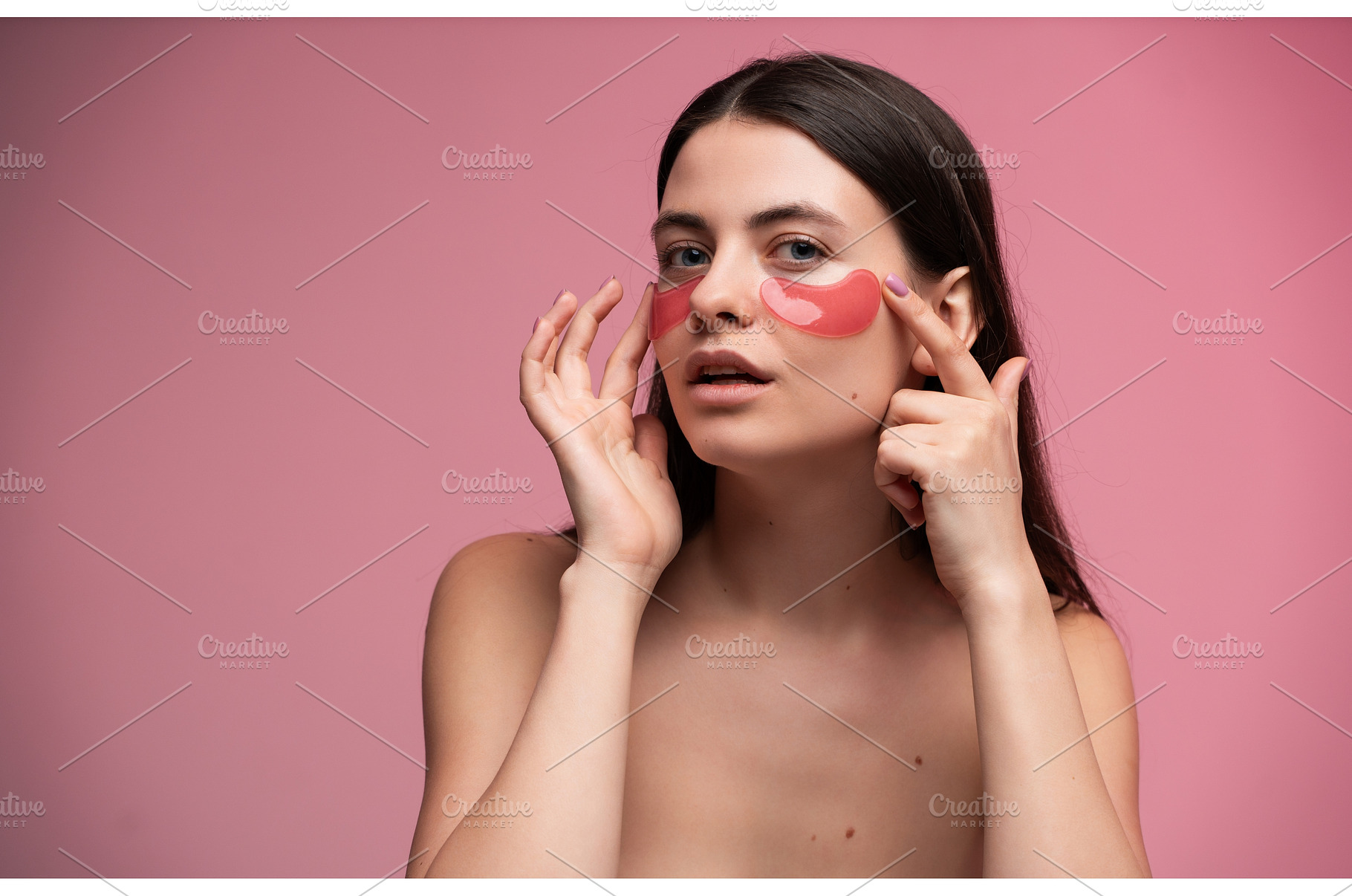 Young woman applying red hydrogel, a Health & Medical Photo by volodymyrshtun13795