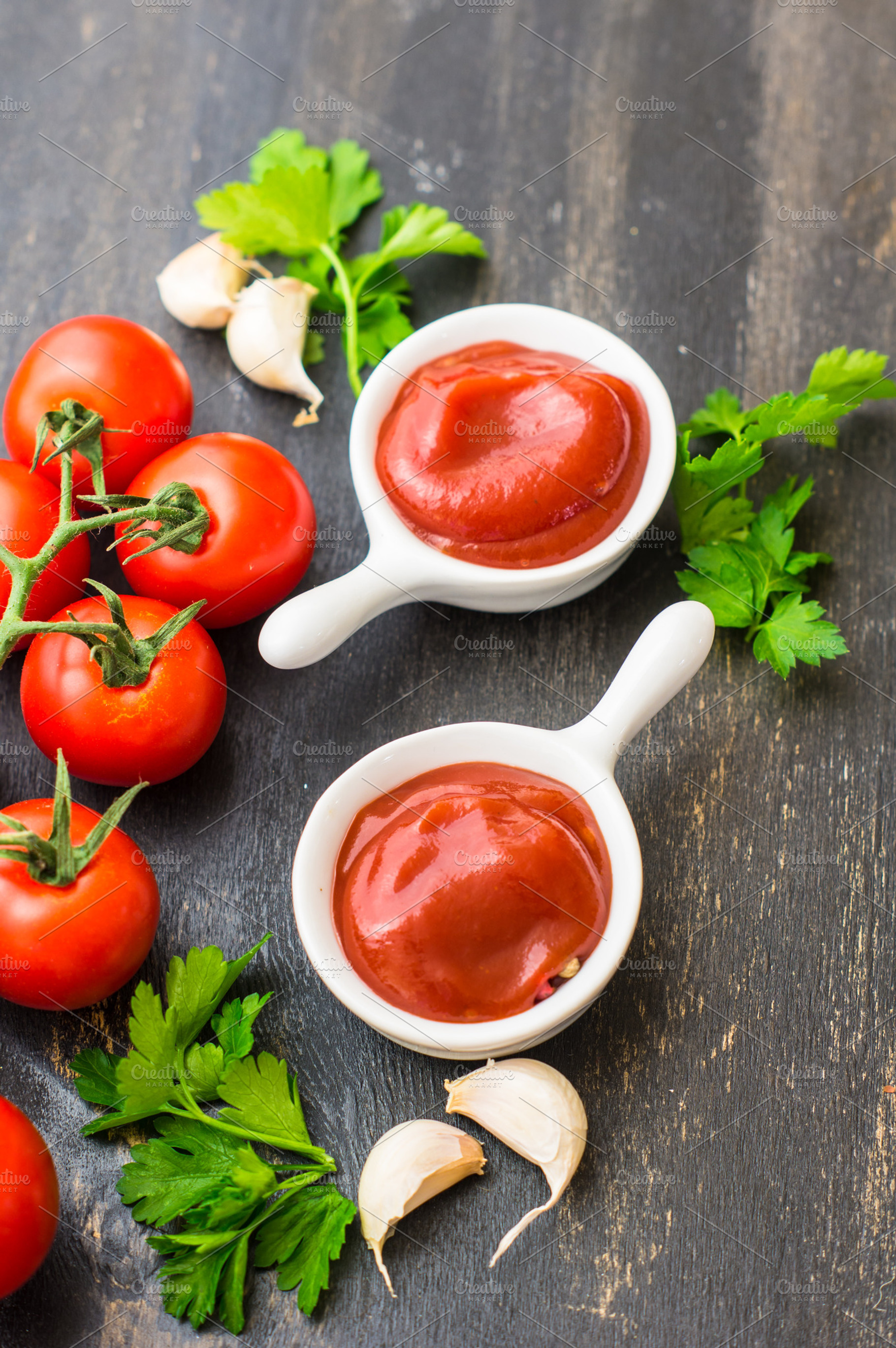 Tomato ketchup sauce containing around, black, and board, a Food & Drink Photo by Anna Bogush
