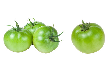 Three green unripe tomato isolated, a Food & Drink Photo by NataPhoto