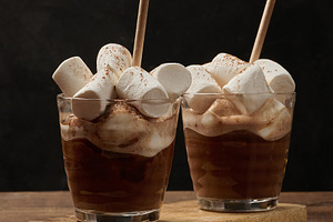Two glasses of hot chocolate with fluffy marshmallows and a stra, a Food & Drink Photo by ndanko