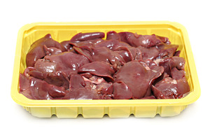 Raw liver in the plastic plate isolated, a Photo by saiko3p