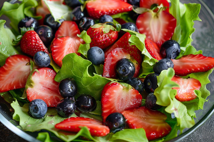 A vibrant salad features crisp lettu, a Photo by Tanuart